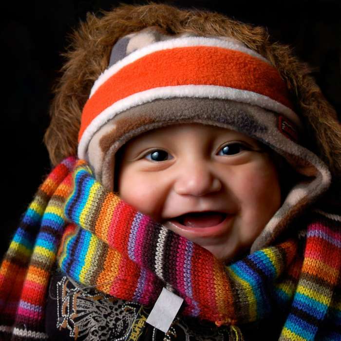 Photo of a baby wearing many items of winter clothing, 2007